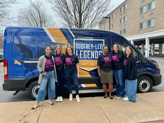 Administrators in front of our new vans